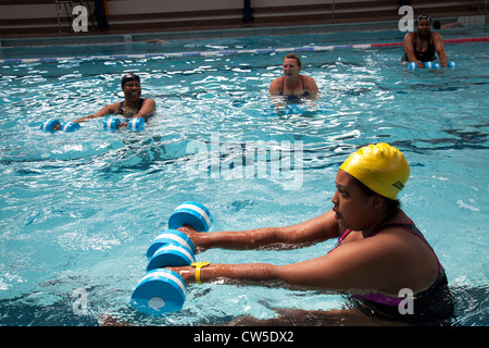 Exercise class at Cally Pool swimming pool, London. People join the class for reasons including weight loss and general fitness. Stock Photo