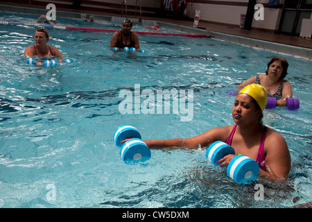 Exercise class at Cally Pool swimming pool, London. People join the class for reasons including weight loss and general fitness. Stock Photo