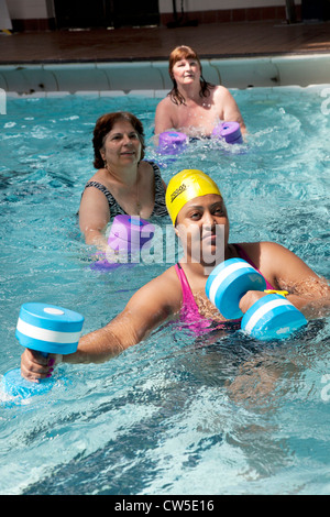 Exercise class at Cally Pool swimming pool, London. People join the class for reasons including weight loss and general fitness. Stock Photo