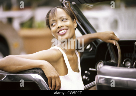 Young woman sitting in a car Stock Photo