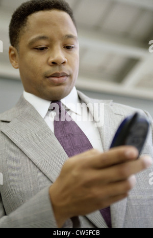 Businessman operating a mobile phone Stock Photo