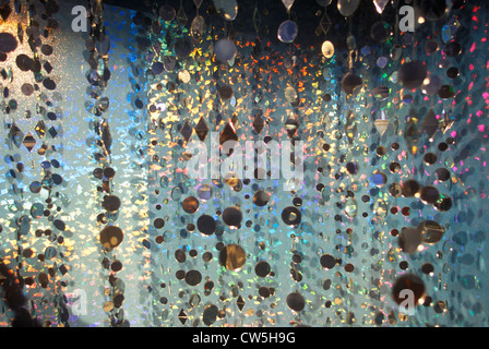Multicolored glowing crystals hanging in strands Stock Photo