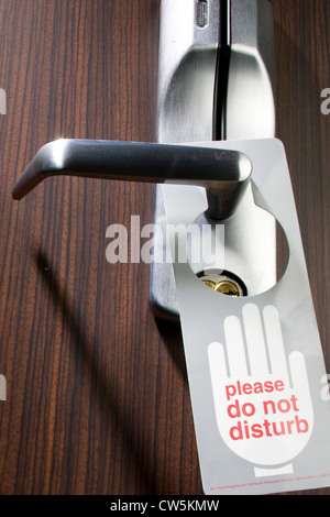 Do Not Disturb Sign Hanging From A Hotel Room Door Handle Stock Photo 