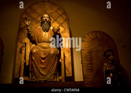 A sculpture of the eternal Father, God, holding the globe of the world, in the Museum of Oaxacan Cultures in Oaxaca, Mexico Stock Photo