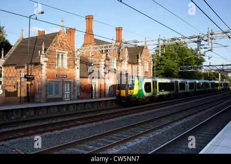 A London Midland train pulling out of Atherstone railway station. Stock Photo