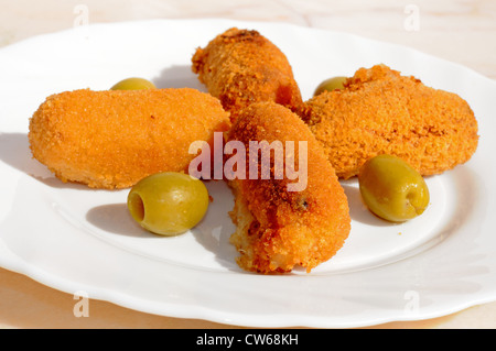 Ham and potato croquettes tapas with green olives, Andalusia, Spain, Western Europe.