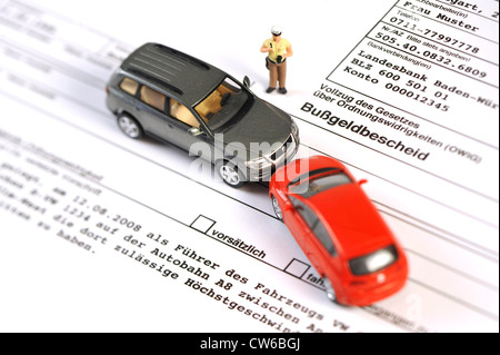 symbolic picture: acquisition of accident data, little police man figure and model cars on a fine document Stock Photo