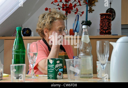old woman sitting in her apartment, home for elderly, Germany Stock Photo