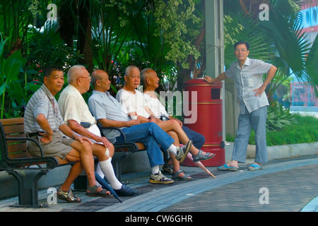 group of elderly Chinese, relaxing on a park bench in Hong Kong, China, Hong Kong Stock Photo