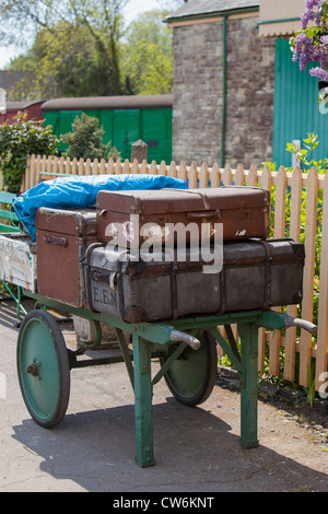 old fashioned suitcases and porters trolleys at Corfe station. Swanage Railway Dorset England UK Stock Photo