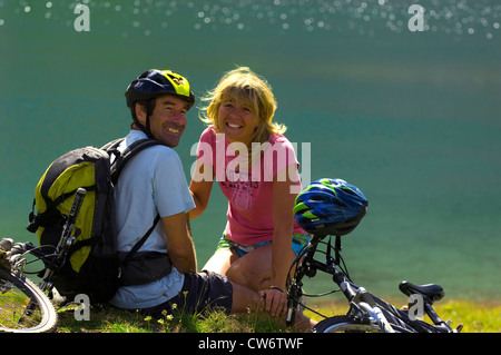 couple taking a break during a bicycle tour, France Stock Photo