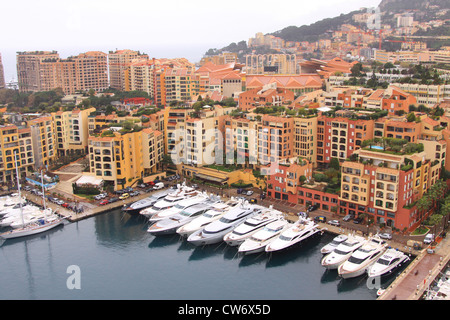 luxurious ships in the harbour of Monte Carlo with houses and roof gardens, Monaco, Monte Carlo Stock Photo