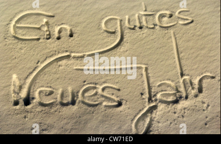 'Ein gutes neues Jahr', happy new year, written in the sand Stock Photo