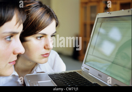 two ladies with a notebook Stock Photo