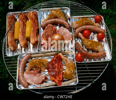meat and sausages on a barbecue grill Stock Photo