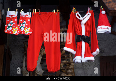 Santa Claus' clothes hanging on the line Stock Photo