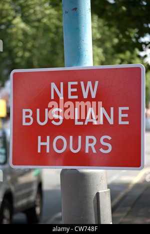 new bus lane hours sign in chiswick, london, england Stock Photo - Alamy