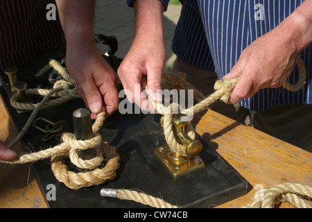 two sailors doing a sailor's knot, Germany, Bremen Stock Photo