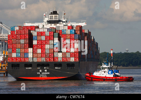 tugboat and container ship in Port of Hamburg, Germany, Hamburg Stock Photo