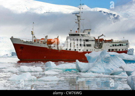 vessel Antarctic Dream in drift ice, Antarctica, Neko Cove Harbor Stock Photo