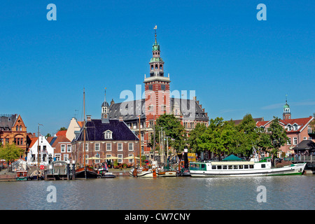 view at the harbour dominated by the city hall, Germany, Lower Saxony, East Frisia, Leer Stock Photo