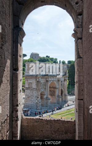 View of Arch of Constantine through an archway in the interior of the Colosseum, Rome, Italy, Europe Stock Photo