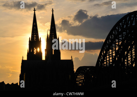 Cologne cathedral in the evening with Hohenzollern bridge, Hohenzollernbruecke, Germany, North Rhine-Westphalia, Cologne