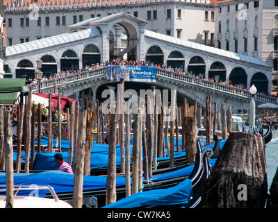 Gondolas near the Rialto Bridge on the Grand Canal Venice, Italy Stock Photo