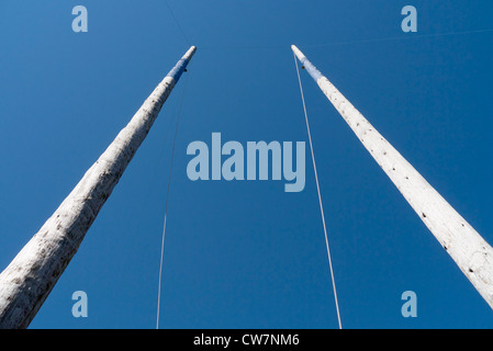 Two 100ft (30m) poles used for the Welsh Open Speed Pole Climbing competition, Royal Welsh Show 2012. Stock Photo