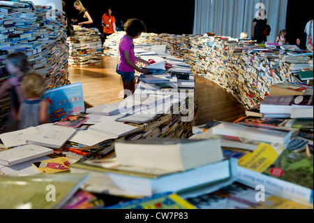 Created by Marcos Saboya and Gualter Pupo, aMAZEme immerses the audience in a labyrinth of books. Stock Photo