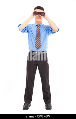 full length of businessman looks through binoculars and isolated on white Stock Photo