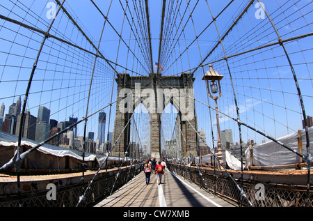 Tourists on Brooklyn Bridge New York City Stock Photo