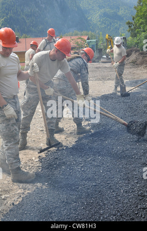 Members of the Wyoming Air National Guard’s 153rd Civil Engineer Squadron lay asphalt Aug. 13, 2012, at the NATO School recreation center, Oberammergau, Germany. Airmen from the 153 CES are putting their skills to work as they conduct their Annual Training. ( Stock Photo