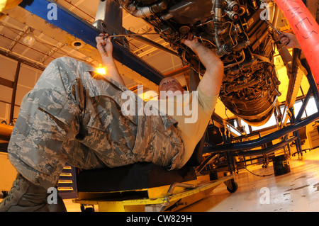 Air National Guard Staff Sgt. John McKay, 173rd Fighter Wing propulsion shop, works on general tasks and maintenance of a F-15 engine at Kingsley Field, Ore., Aug. 15, 2012. The efficiency and skill of the propulsion shop contributes to the great success of the 173rd Maintenance Group. Stock Photo