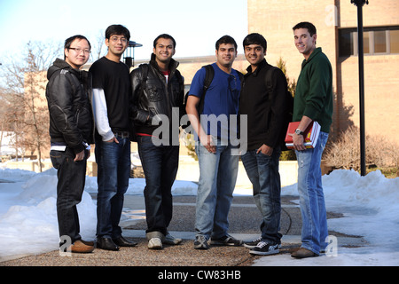 Diverse group of male college students in school campus Stock Photo