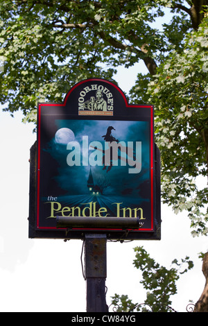 Moorhouses Pendle Hill Witches country pub sign, Flying witch on broomstick in moonlight, painted pub sign in Barley, Lancashire, UK Stock Photo