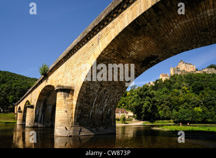 View of the Castelnaud castle from under a bridge over the Dordogne river, Dordogne, Perigord noir, France Stock Photo