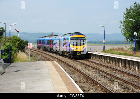 Class 185 diesel multiple unit No 185111 approaches Arnside railway station, Cumbria, England, UK Stock Photo