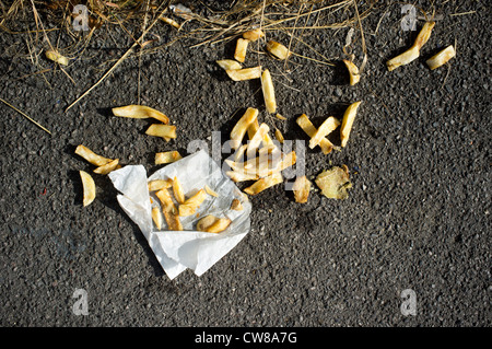 Discarded chips and wrapper Stock Photo