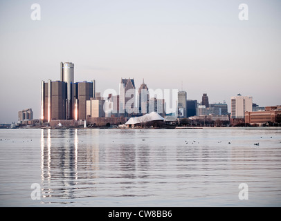 Detroit Michigan skyline as seen across the Detroit River it is winter and there is a thin sheet of ice on the water. Stock Photo