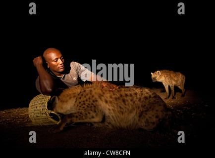 Hyena man feeding wild hyenas in Harar Ethiopia. Stock Photo