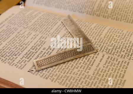 King James Bible on a Masonic altar with a set square Stock Photo