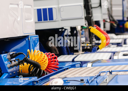 A row of hose reels hanging from the ceiling of an automotive repair shop  Stock Photo - Alamy