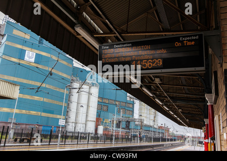 A departure board at Warrington Bank Quay railway station on the West Coast Mainline. Stock Photo