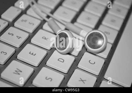 Apple wireless keyboard and headphones Stock Photo