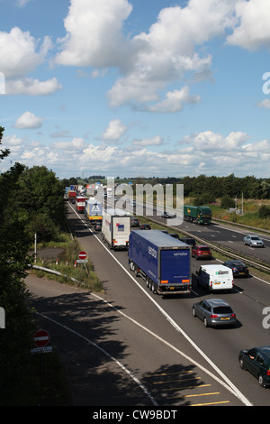 Traffic jams and a queue of traffic on the M6 motorway in England.the M6 Toll road adjoins the M6 and helps congestion and jams