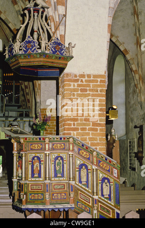 The 1703 pulpit and sounding board inside the 15th century medieval Church of St. Catherine in Raseborg, Finland Stock Photo