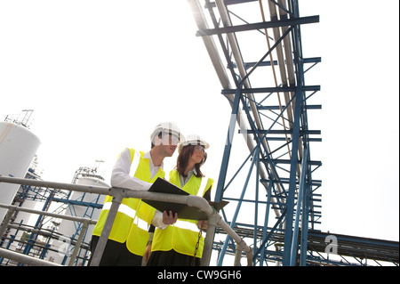 technicians working in industrial chemical plant, norfolk, england Stock Photo