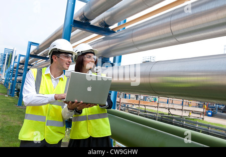 technicians working in industrial chemical plant, norfolk, england Stock Photo