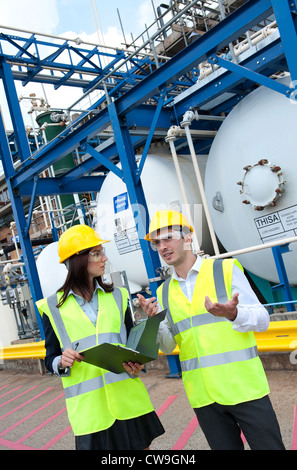 technicians working in industrial chemical plant, norfolk, england Stock Photo